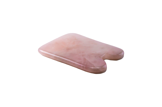 Rose quartz facial gua sha tool on a clean white background