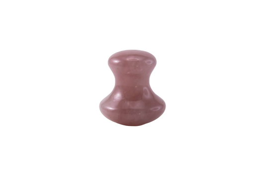Rose quartz button-style gua sha tool for gentle facial massage