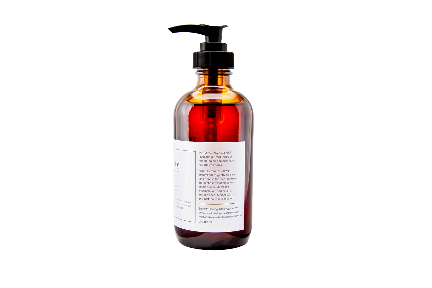 Eight ounce Facial Cleansing Oil and Serum bottle with label visible