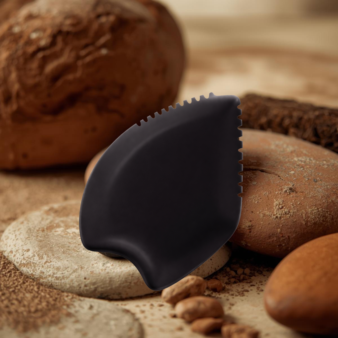 Bian stone gua sha tool showing the polished multi-edge shape