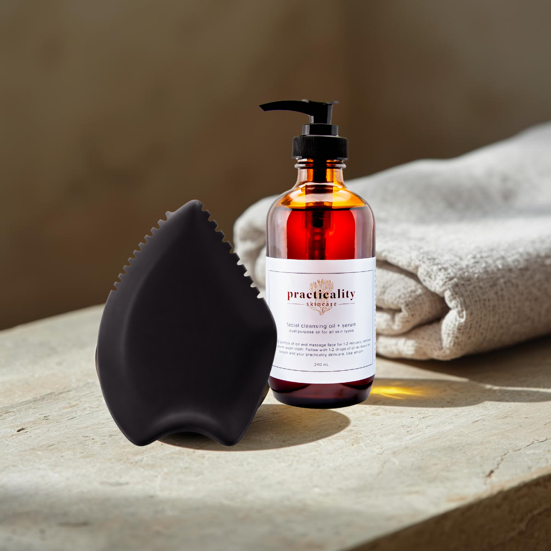 Bian stone facial gua sha displayed with Practicality facial cleansing oil